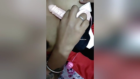 Indian wife enjoys herself on her laptop and a dildo
