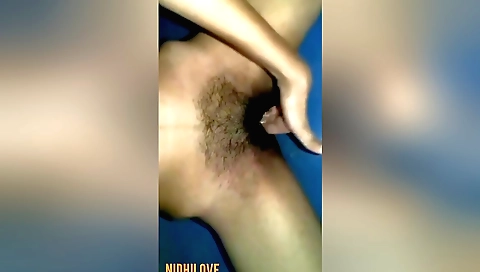 Indian teen with a hairy pussy shows off in a hot bath