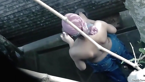 Indian amateur solo female in bathing in the outdoor