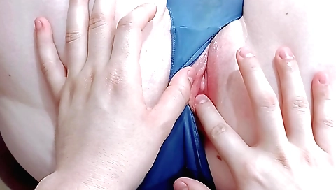 Petite 18-year old chick plays with her small pussy