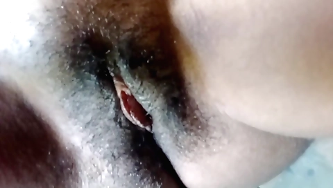 Amateur brunette takes off her clothes in a solo scene