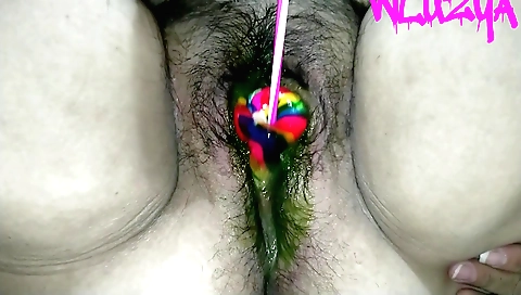Indian solo female uses a candy lollipop to masturbate