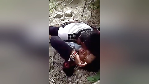 Indian brunette getting herself wet inside a hot camp-fire