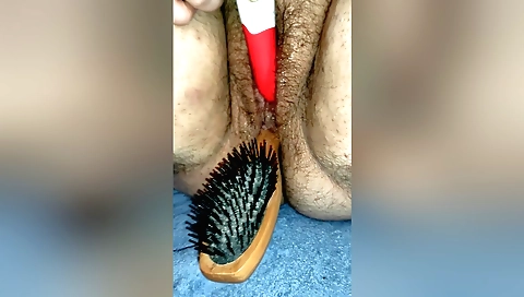 Sexy blonde hairbrush and a hairy pussy in amateur solo video