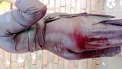 Indian girl in red lingerie and a pink skirt is in a bathroom