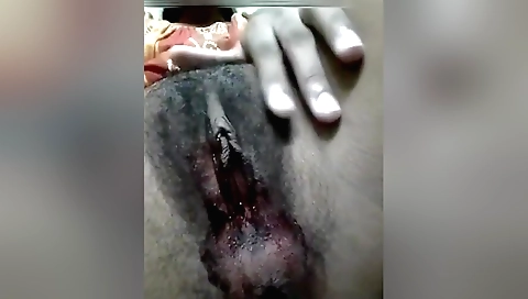 Hairy brunette girl wearing sexy dress shows cute pussy