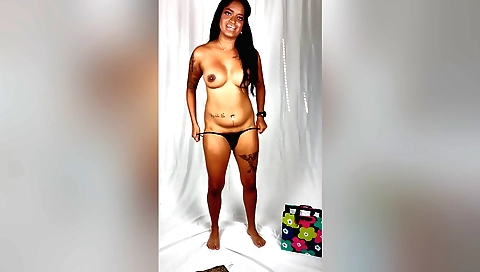 A sexy tattooed girl with small tits and curves shows off