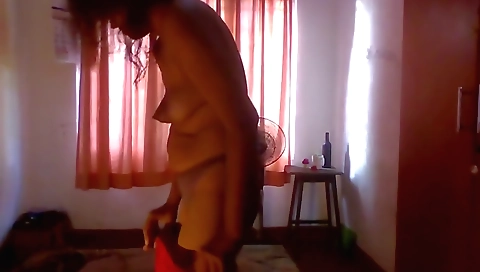 Solo female showing off her body in a dressing room