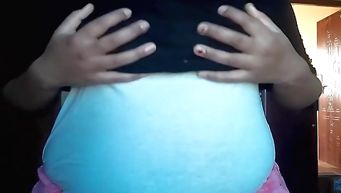 Indian solo video of a busty brunette with a shaved pussy