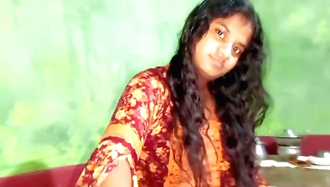 Indian brunette girl in a long white dress and red socks